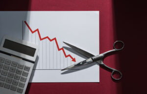 Chart showing negative trend and scissors, to illustrate LGDF proposed cuts