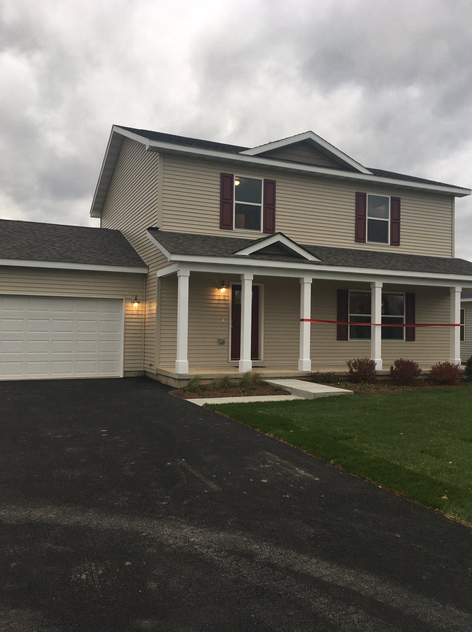 Newly Built Kennedy Crossing Home with Red Ribbon